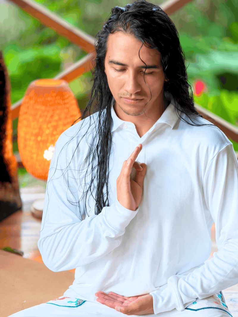 Hanan, our ceremonial maestro, seated with eyes closed