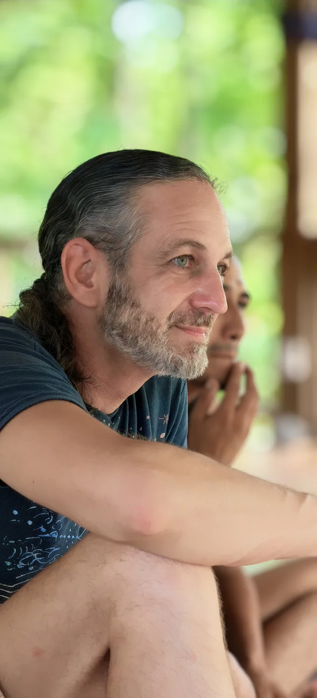 A participant listening during a group gathering