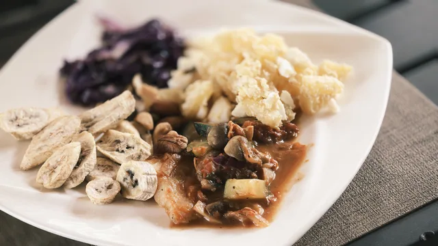 A plated meal with vegetables and grains