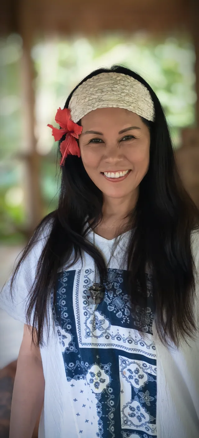 A smiling participant in the pavilion