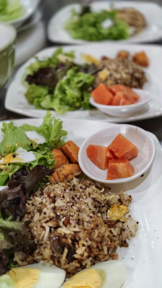 A shared meal with vegetables, grains and fruit