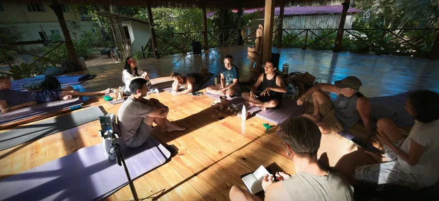 Participants seated together in the pavilion